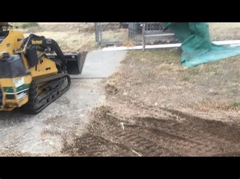 tracked or tired skid steer removing rocks from property|tractor skid steer tires.